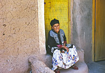 Woman Sitting in Doorway